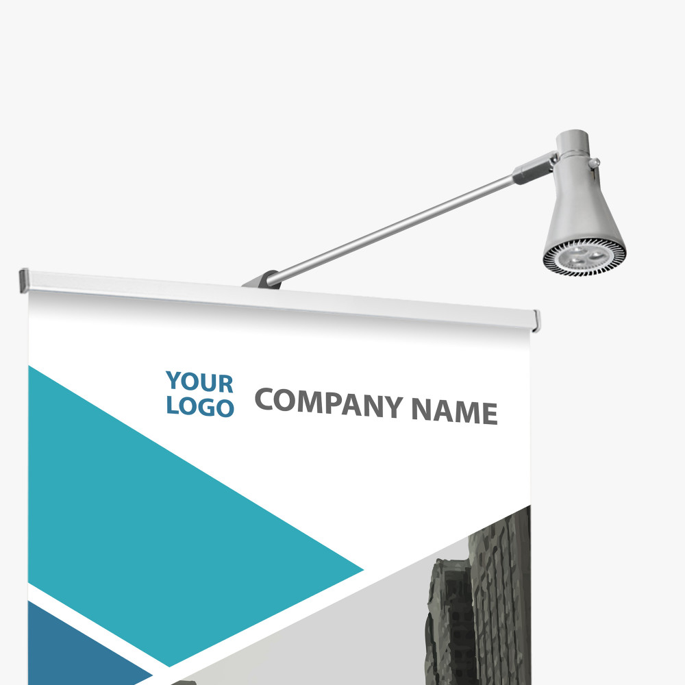 Apex deluxe retractable banner stand with a clip-on LED banner light illuminating the printed graphic