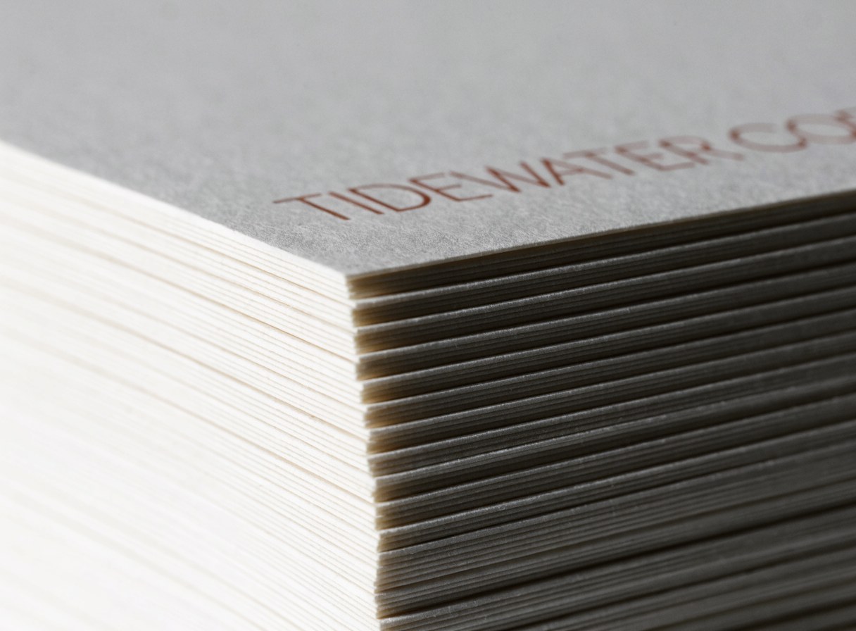 Stacked edges of 16pt business cards showing the thickness of the stock